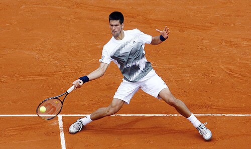 Serbia's Novak Djokovic returns the ball to Germany's Denis Gremelmayr during their first round match at the French Open tennis tournament in Paris on May 25, 2008. French Open 2008, Day 1